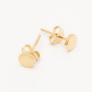 Mastering the Art of Stacked Earrings: Smooth Disc Studs as the Perfect Foundation